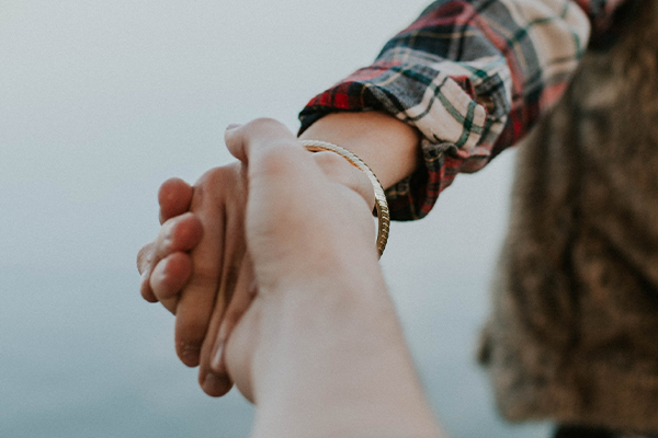 a couple holding hands