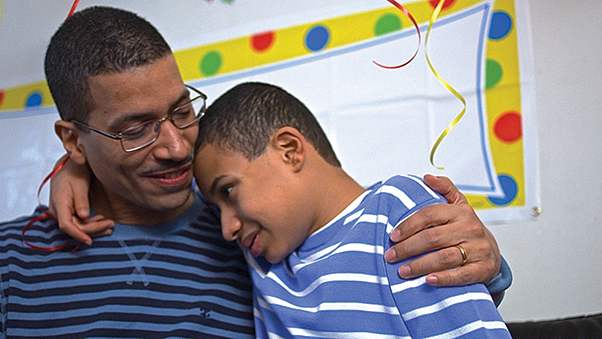 a father and son hugging