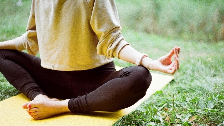 A person doing yoga outdoors