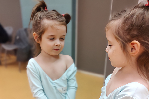 Ayah looking in the mirror at the dance studio