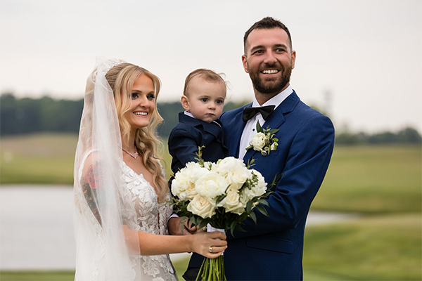 Jack and his parents at their wedding