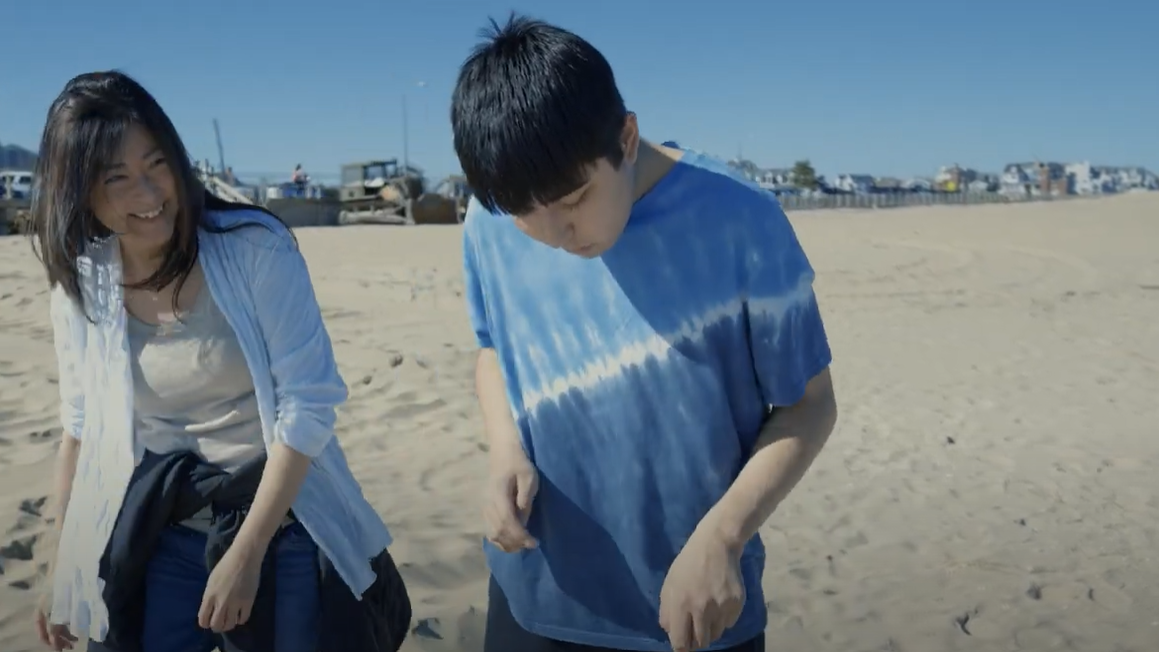 Jack and Mona walking on the beach