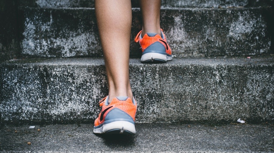 someone walking up steps in sneakers