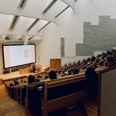 Students in a lecture hall watching a presentation