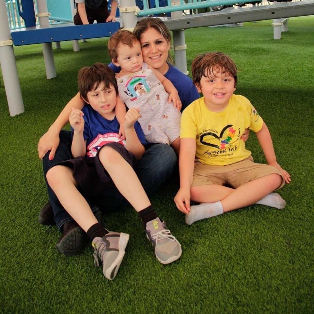 Susy, Mason, Robert and Jacob sitting in the grass