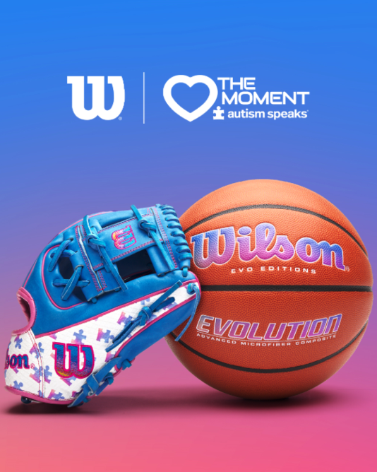 Wilson baseball glove next to a basketball