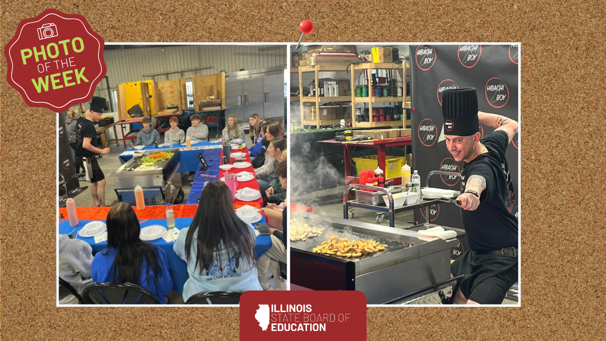 Students watch chef cook on hibachi grill. 