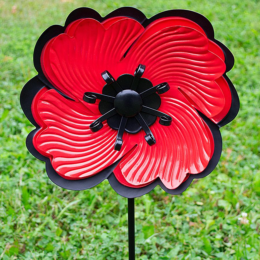A vibrant red metal poppy with a post to stick into the ground
