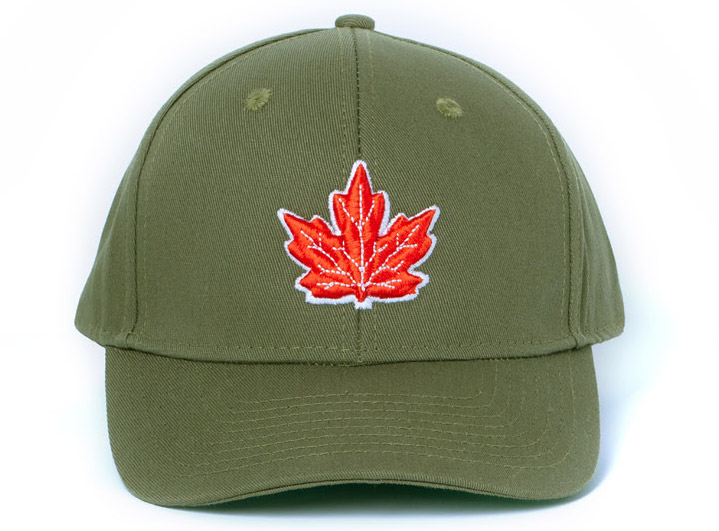 Army green ball cap features a bold 3D puff embroidered red maple leaf drawn from The Royal Canadian Legion’s Royal Crest