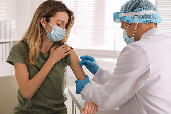 Woman getting COVID Vaccine