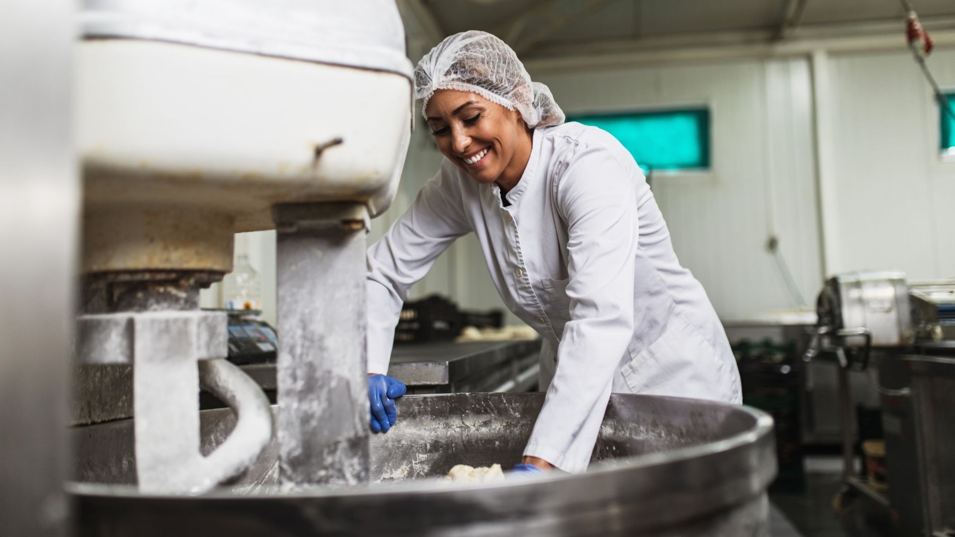 person working with a commercial-grade mixer